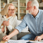 April 25 Events Page Image - The Ranch Estates of Tucson Elderly man and woman smiling and holding small dog