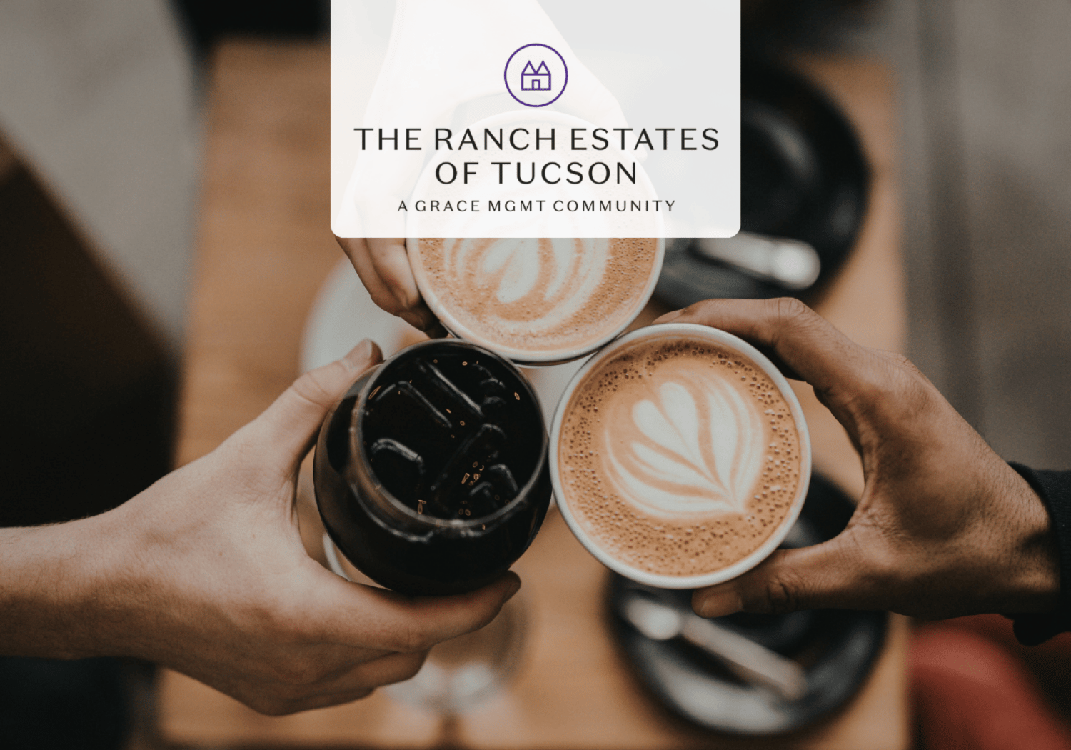 Top-down view of three hands toasting with coffee cups, featuring latte art and a branding overlay for The Ranch Estates of Tucson.